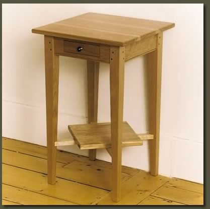 A delicate drawer and angled shelf make our Red Birch End Table highly functional and decorative
